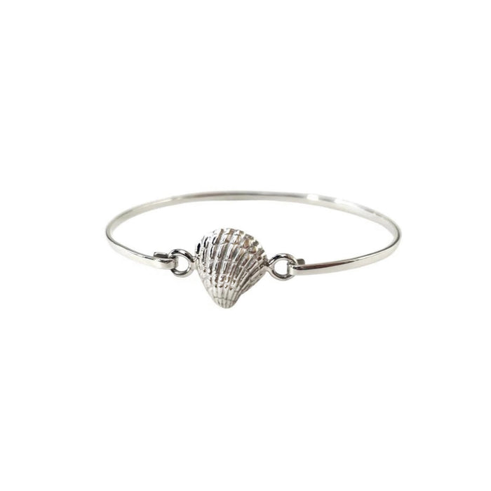 oval silver bangle with a shell attached